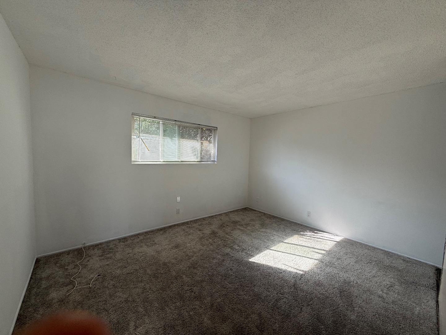 117 Adler Avenue Campbell, CA 95008 - Photo 6 of 7 an empty room with a empty space and windows