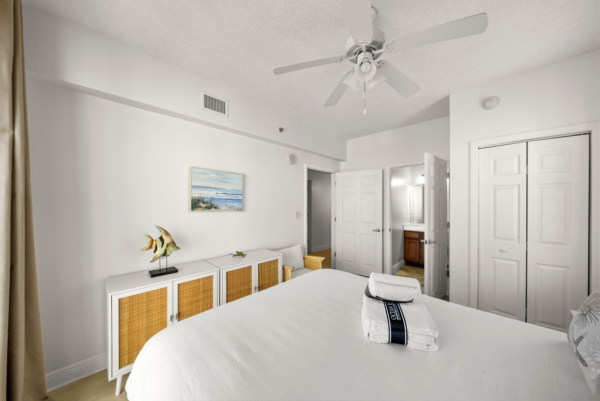 112 Seascape Drive, Unit 1910 Miramar Beach, FL 32550 - Photo 15 of 49 a bedroom with a bed and a chandelier