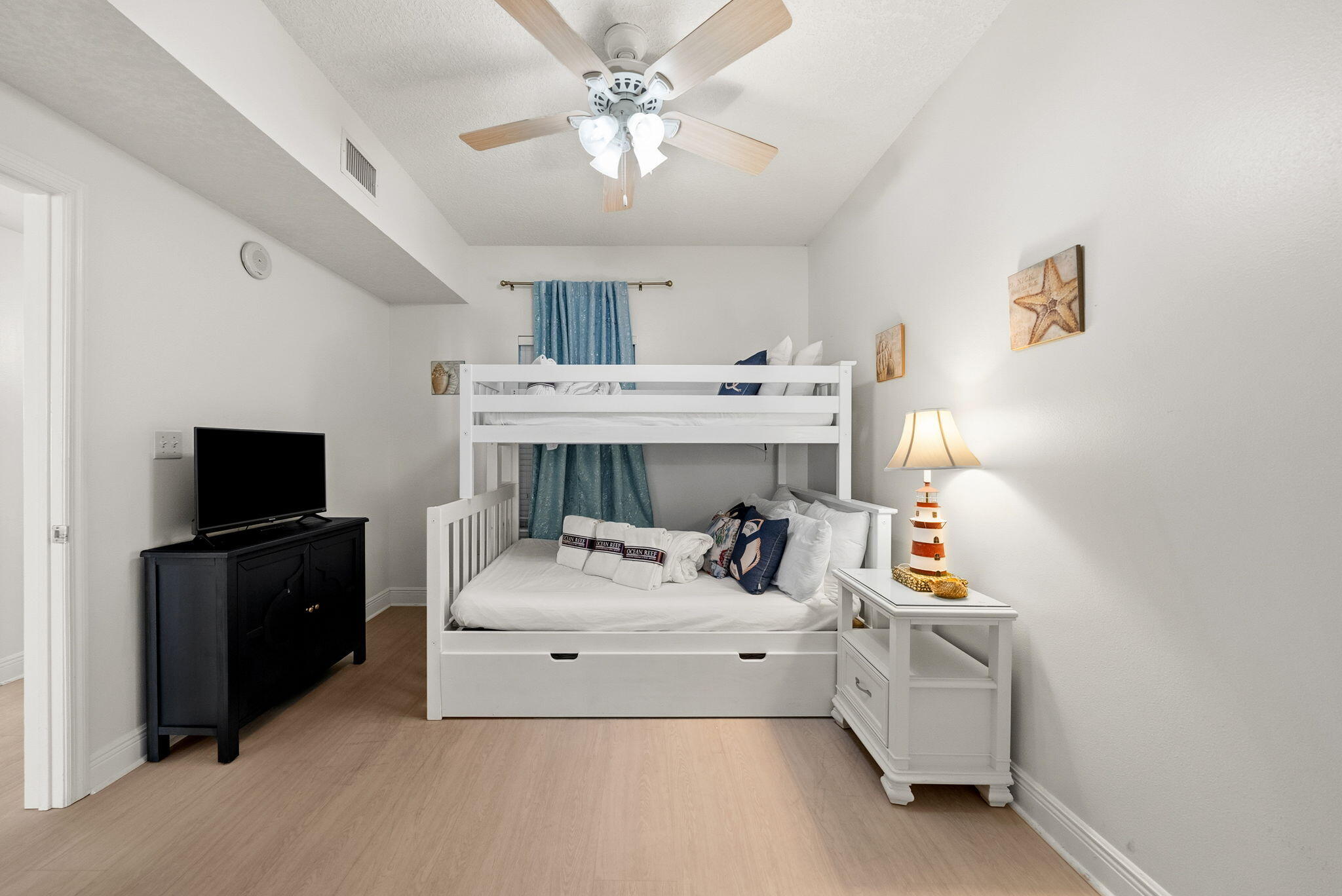 112 Seascape Drive, Unit 1910 Miramar Beach, FL 32550 - Photo 18 of 49 a living room with furniture and a flat screen tv