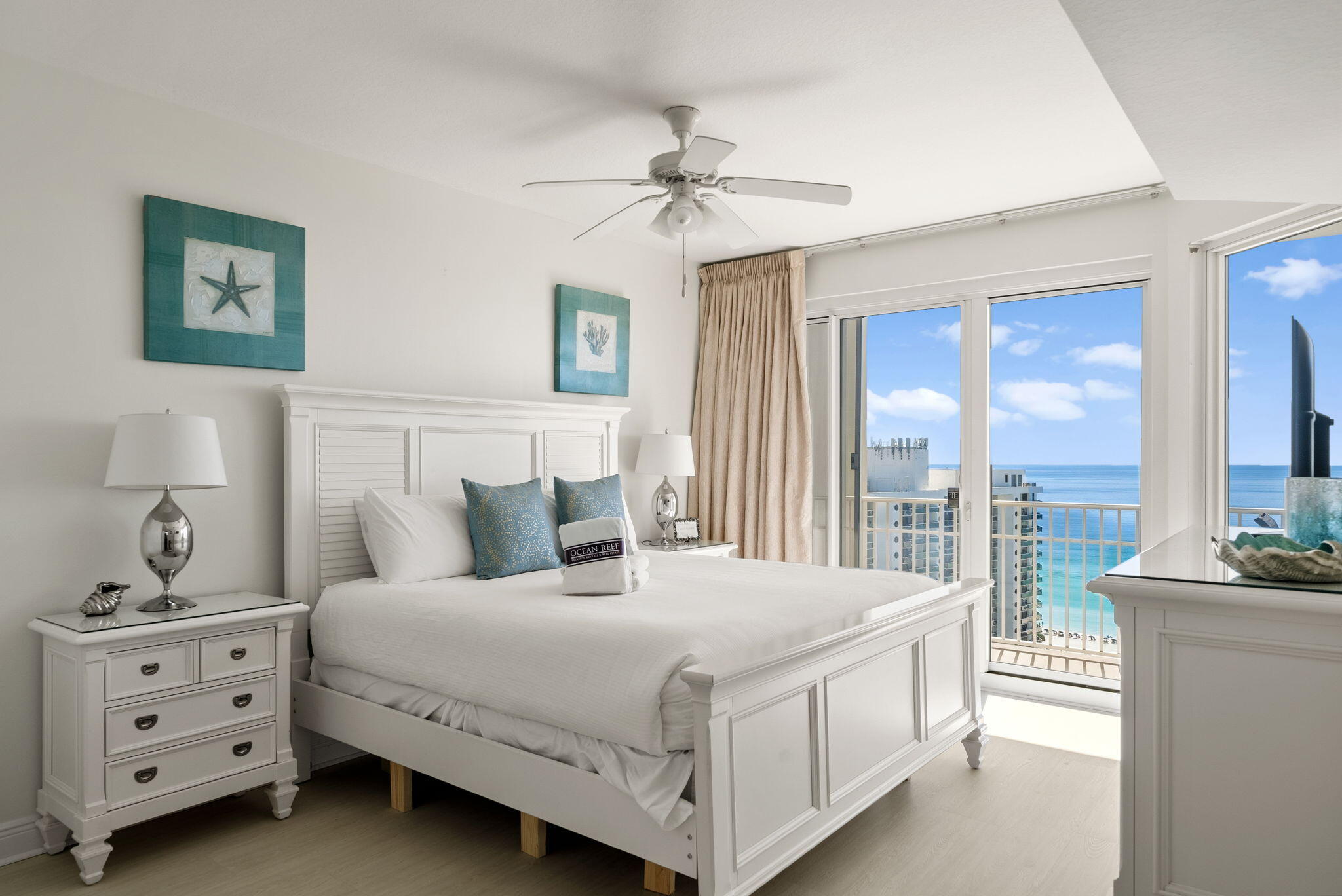 112 Seascape Drive, Unit 1910 Miramar Beach, FL 32550 - Photo 20 of 49 a bedroom with a large bed and a chandelier