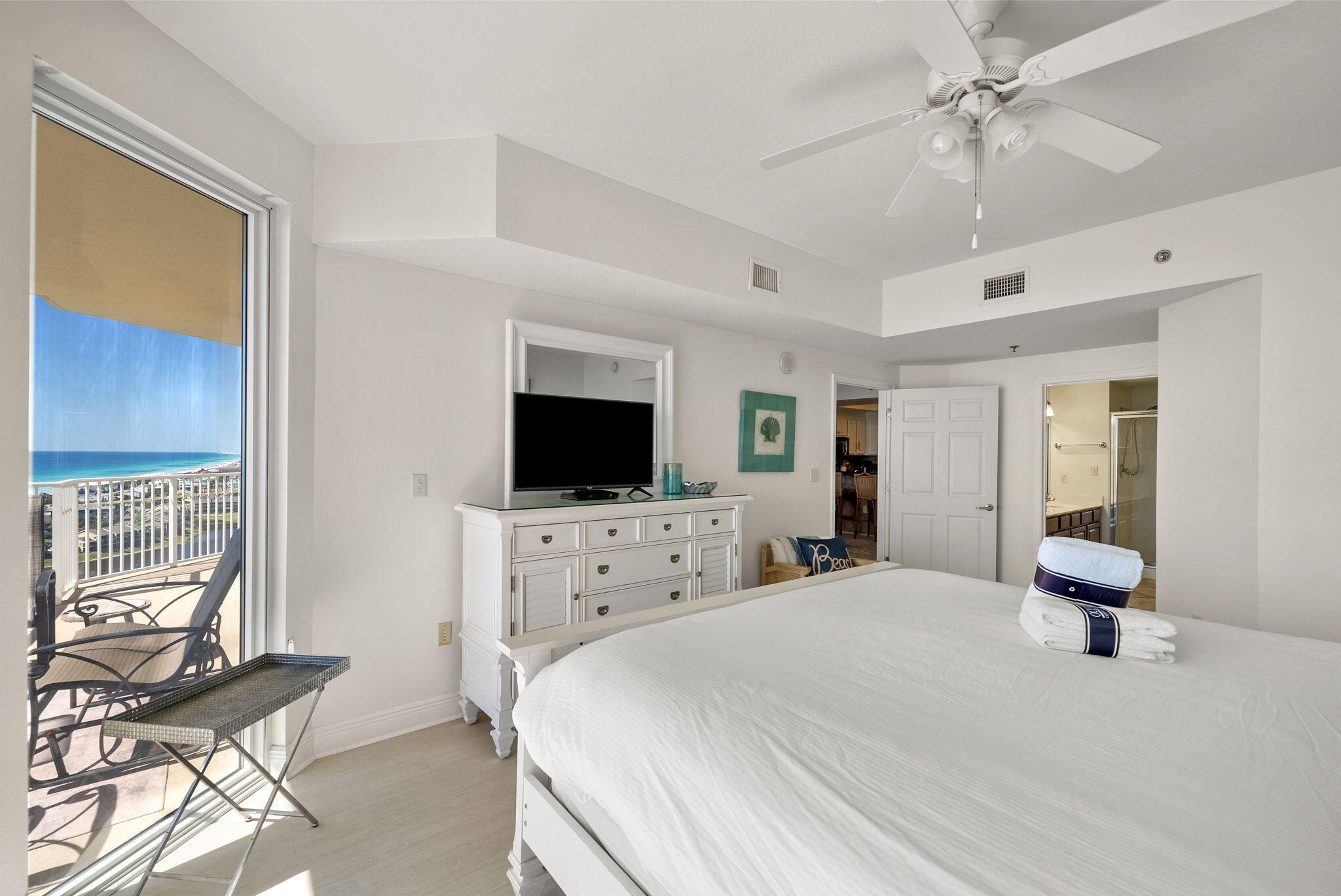 112 Seascape Drive, Unit 1910 Miramar Beach, FL 32550 - Photo 22 of 49 a bedroom with a bed and a flat screen tv