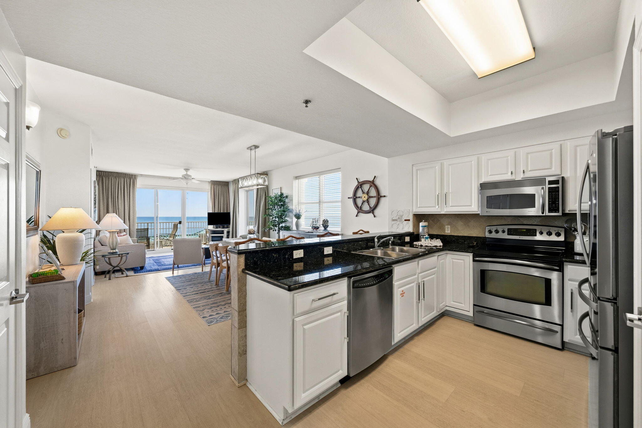 112 Seascape Drive, Unit 1910 Miramar Beach, FL 32550 - Photo 5 of 49 a kitchen with sink stove and cabinets