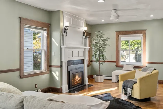 a bedroom with furniture and a fireplace