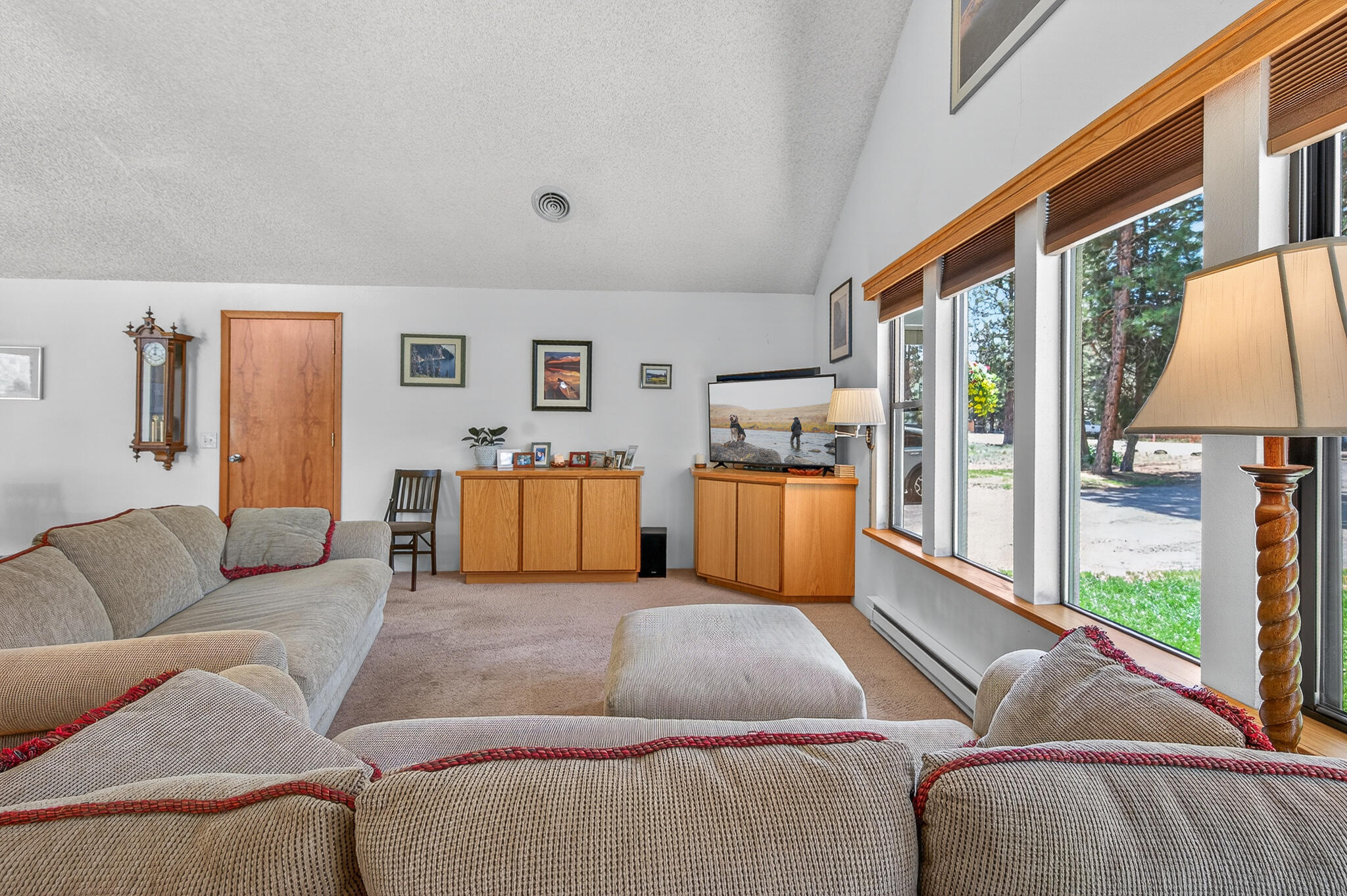 60866 Brosterhous Road Bend, OR 97702 - Photo 9 of 41 a living room with furniture and a large window