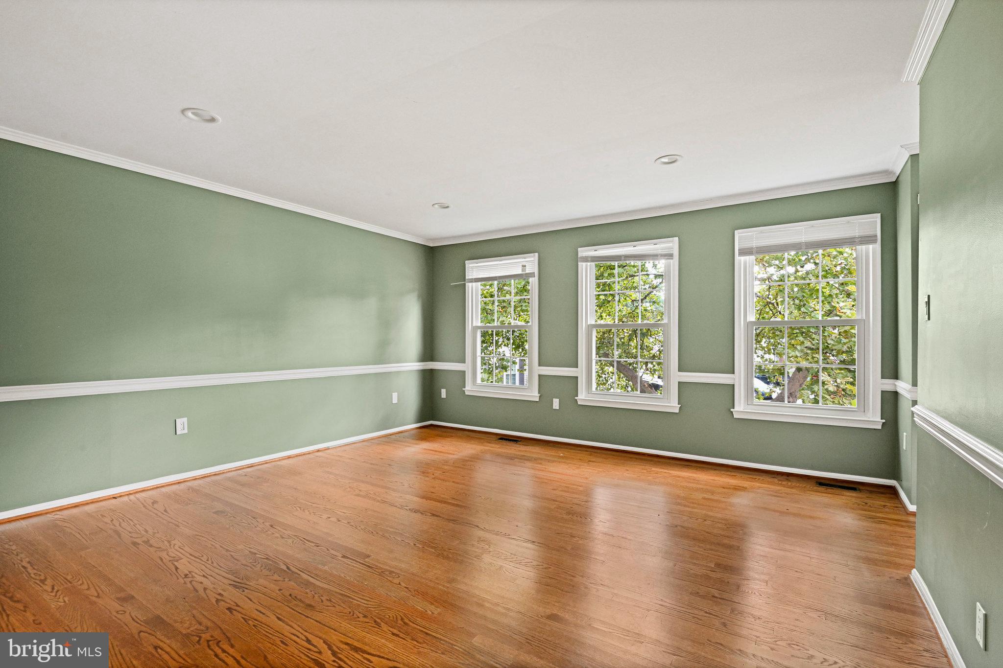 13345 Point Rider Lane Herndon, VA 20171 - Photo 22 of 43 an empty room with wooden floor and windows