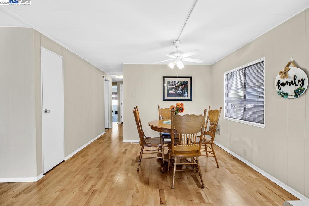 840 Sungold Circle Livermore, CA 94551 - Photo 17 of 28 a view of a dining room with furniture a chandelier and wooden floor