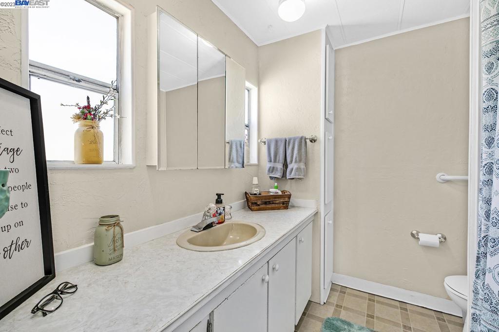 840 Sungold Circle Livermore, CA 94551 - Photo 26 of 28 a bathroom with a sink and a mirror