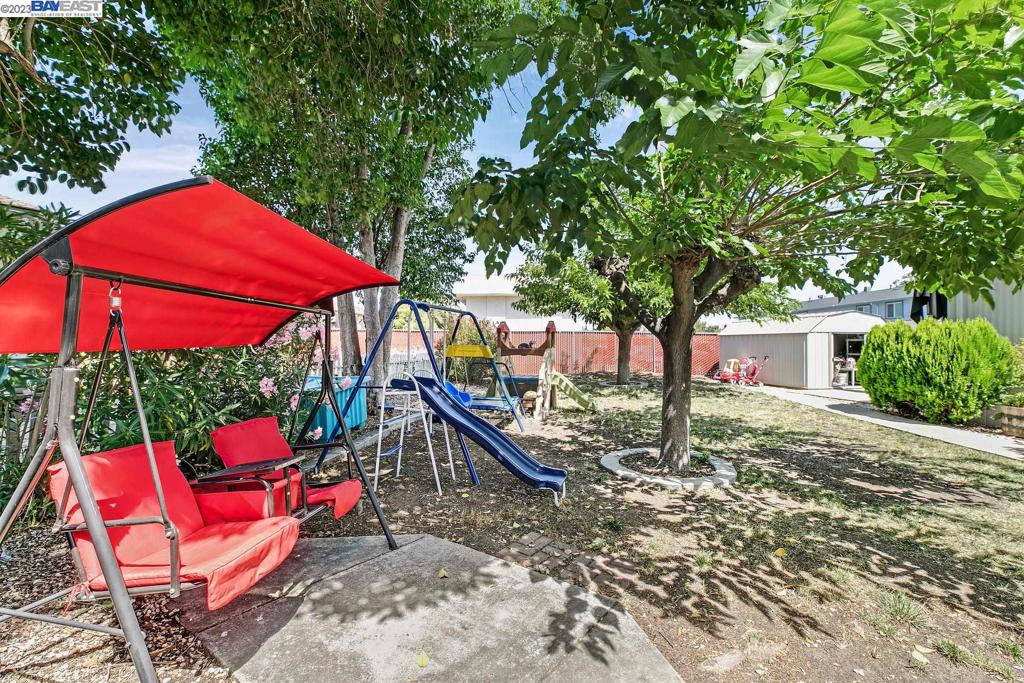 840 Sungold Circle Livermore, CA 94551 - Photo 6 of 28 an outdoor sitting area with red umbrella