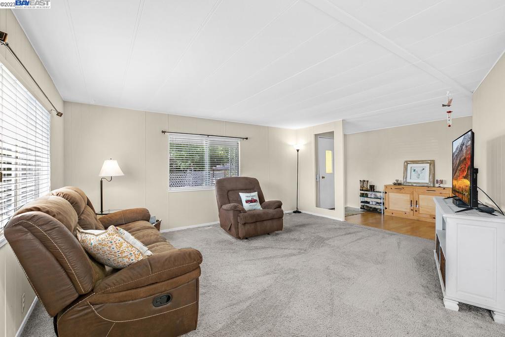 840 Sungold Circle Livermore, CA 94551 - Photo 9 of 28 a living room with furniture and a flat screen tv