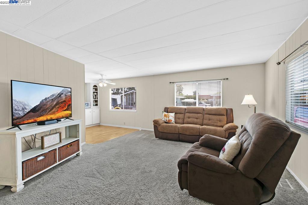 840 Sungold Circle Livermore, CA 94551 - Photo 10 of 28 a living room with furniture and a flat screen tv