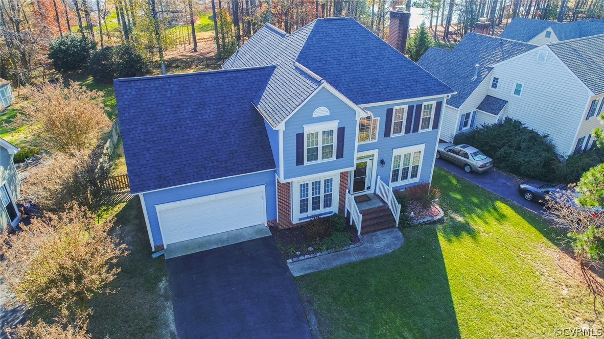 11907 Taplow Road Midlothian, VA 23112 - Photo 1 of 29 a view of a house with a yard patio and a slide