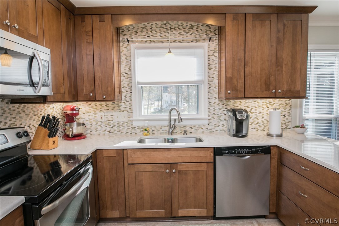 11907 Taplow Road Midlothian, VA 23112 - Photo 11 of 29 a kitchen with a sink stove and microwave