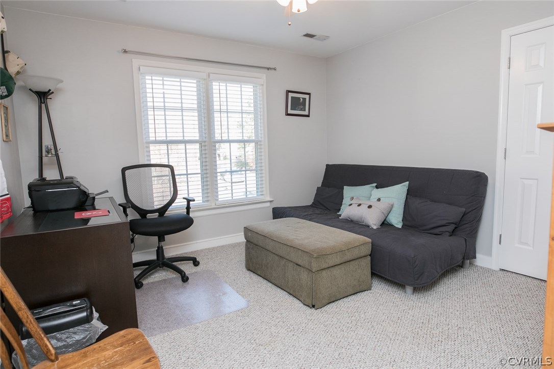 11907 Taplow Road Midlothian, VA 23112 - Photo 18 of 29 a living room with furniture a air conditioner vent and a window