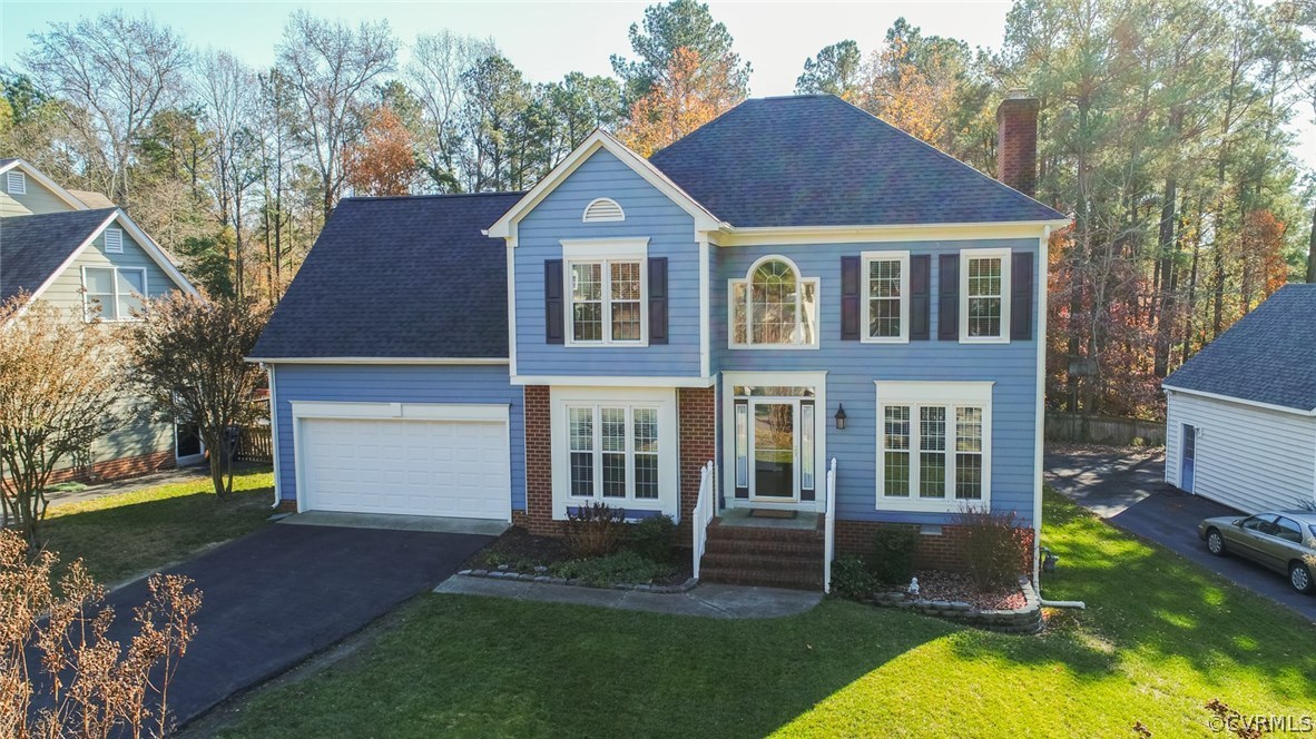11907 Taplow Road Midlothian, VA 23112 - Photo 29 of 29 a view of a yard in front of a house with a yard