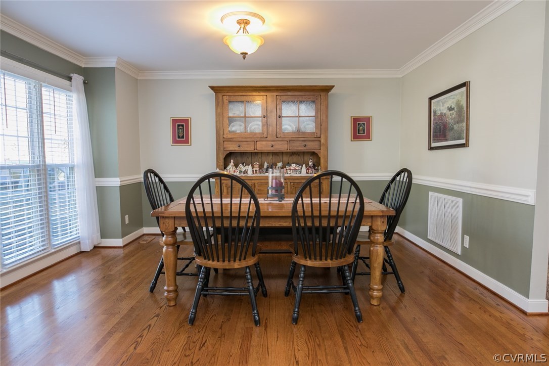 11907 Taplow Road Midlothian, VA 23112 - Photo 5 of 29 a view of a dining room with furniture window and wooden floor