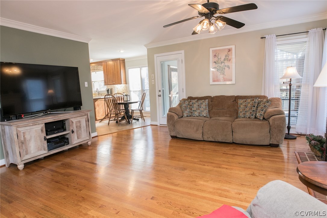 11907 Taplow Road Midlothian, VA 23112 - Photo 7 of 29 a living room with furniture and a flat screen tv