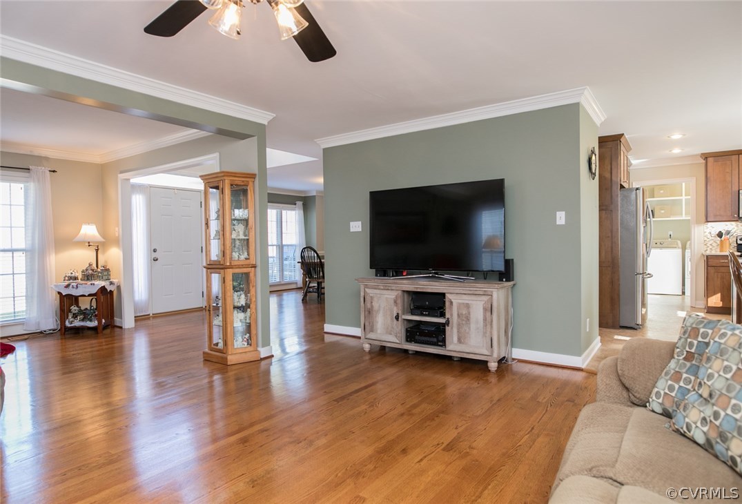 11907 Taplow Road Midlothian, VA 23112 - Photo 8 of 29 a living room with furniture and a flat screen tv