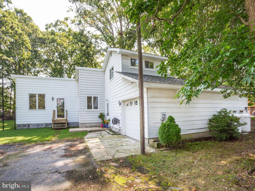 5482 Hallowing Point Road Prince Frederick, MD 20678 - Photo 3 of 39 a view of a house with backyard and a tree