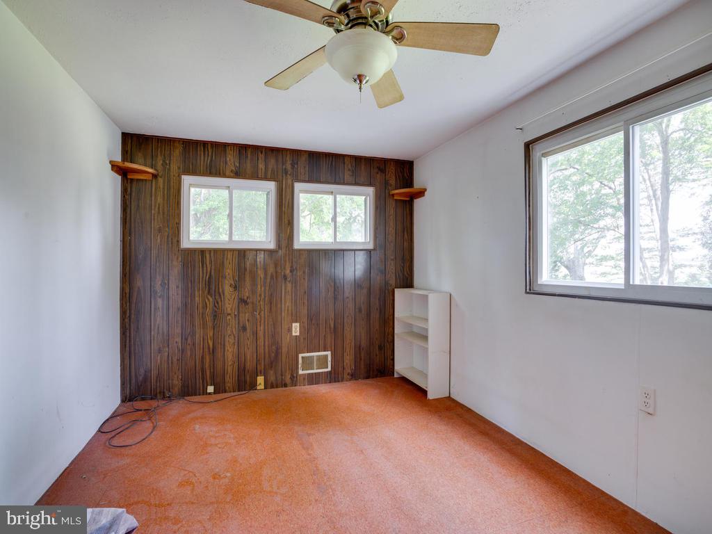 5482 Hallowing Point Road Prince Frederick, MD 20678 - Photo 22 of 39 an empty room with windows and fan