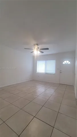 a view of an empty room with windows