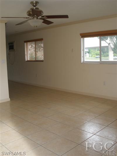 8162 Country Road, Unit 206 Fort Myers, FL 33919 - Photo 5 of 7 a view of an empty room with a window
