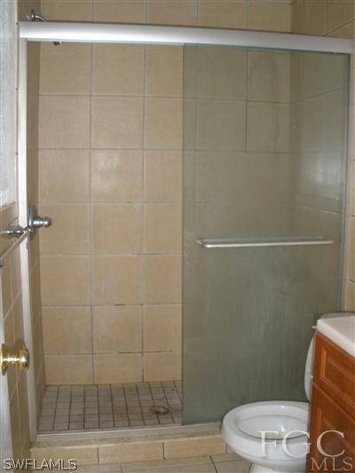 8162 Country Road, Unit 206 Fort Myers, FL 33919 - Photo 6 of 7 a bathroom with a toilet and a shower