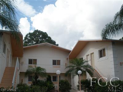 8162 Country Road, Unit 206 Fort Myers, FL 33919 - Photo 7 of 7 a house with palm tree in front of it