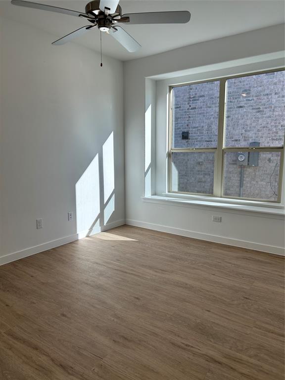 148 Breeds Hl Road Little Elm, TX 75068 - Photo 10 of 20 a view of an empty room with a window