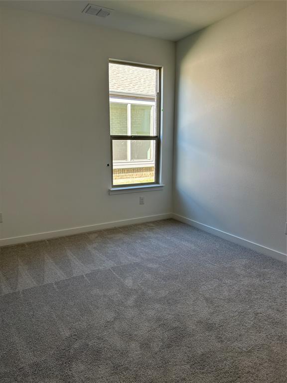 148 Breeds Hl Road Little Elm, TX 75068 - Photo 12 of 20 an empty room with a window