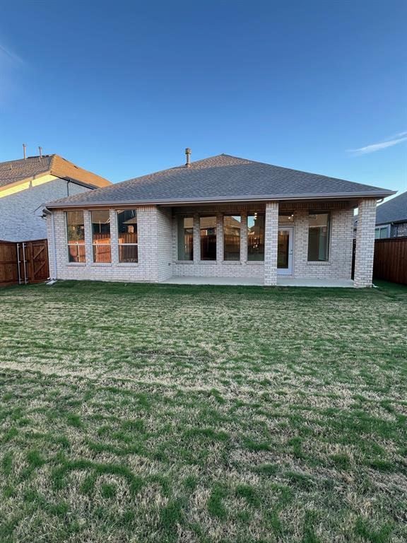 148 Breeds Hl Road Little Elm, TX 75068 - Photo 17 of 20 a front view of a house with a garden