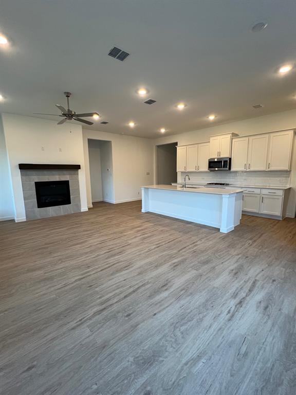 148 Breeds Hl Road Little Elm, TX 75068 - Photo 19 of 20 a view of kitchen with sink microwave and cabinets