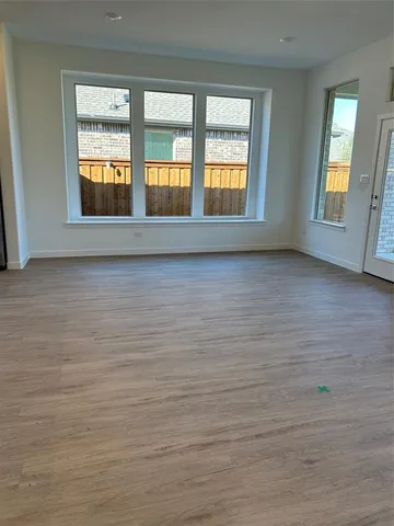 a view of kitchen with sink microwave and cabinets