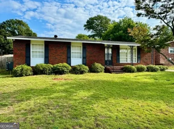 front view of a house with a yard
