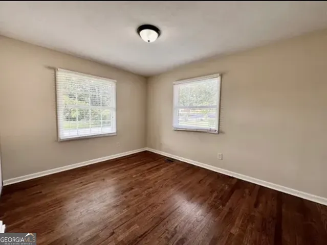 a bathroom with a granite countertop toilet a sink and a bathtub