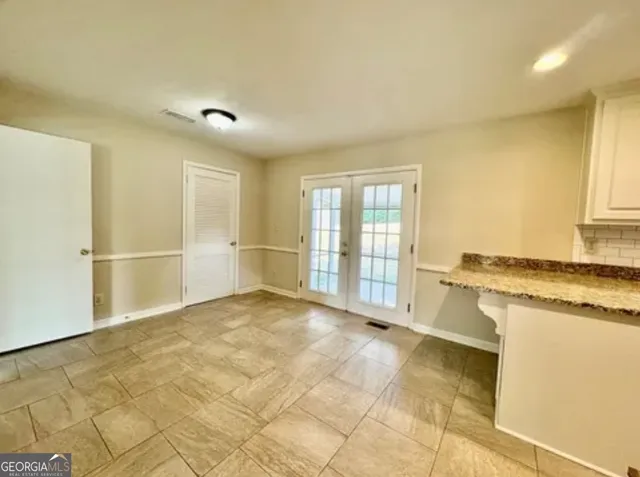 a kitchen with stainless steel appliances a refrigerator stove and microwave