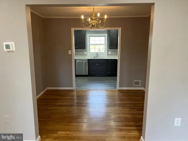 a view of a kitchen from the hallway