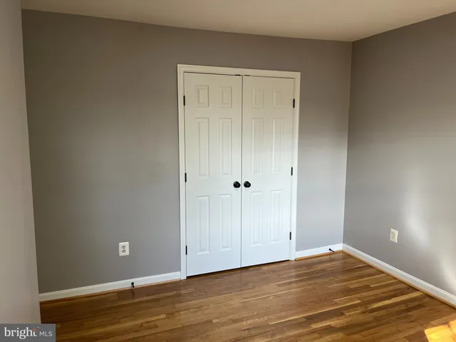 a view of room with wooden floor