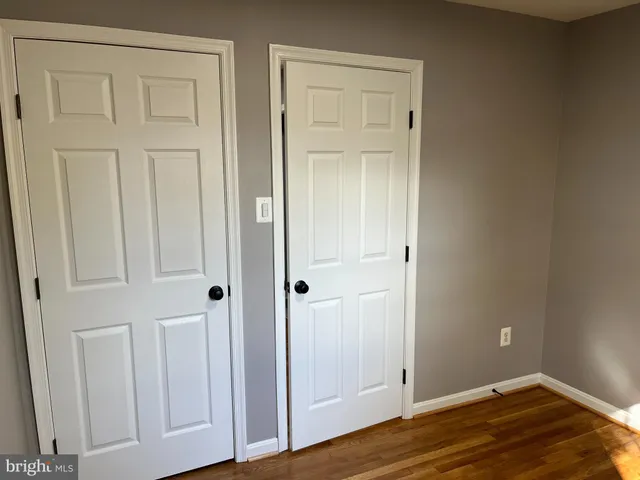 an empty room with wooden floor