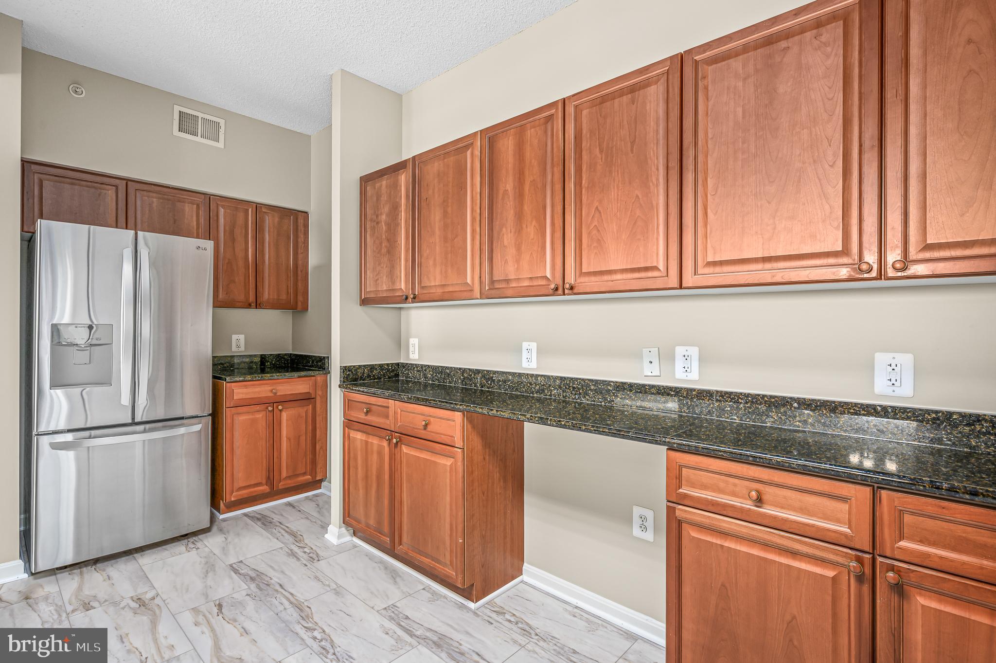 19355 Cypress Ridge Terrace, Unit 802 Leesburg, VA 20176 - Photo 9 of 45 Maple cabinetry