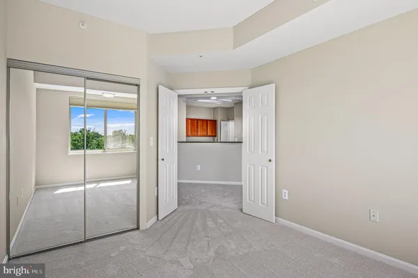 a kitchen with stainless steel appliances granite countertop a stove and a refrigerator