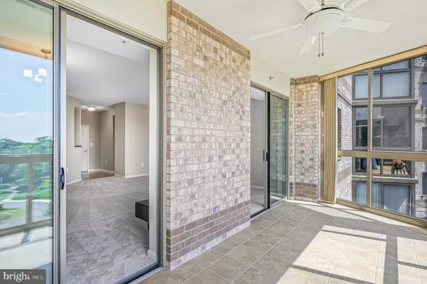 a view of a bathroom with a glass door shower and a sink