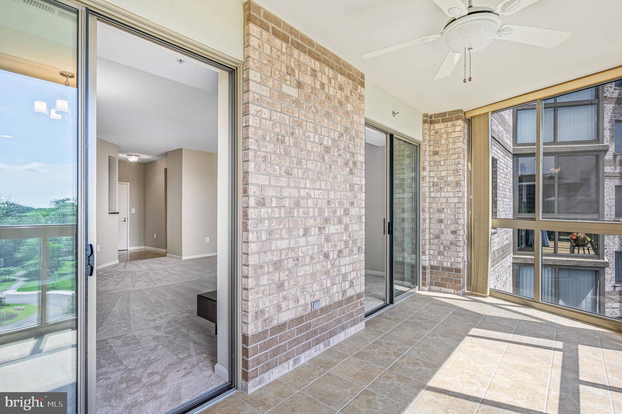 19355 Cypress Ridge Terrace, Unit 802 Leesburg, VA 20176 - Photo 6 of 37 Double sliding doors to sunroom