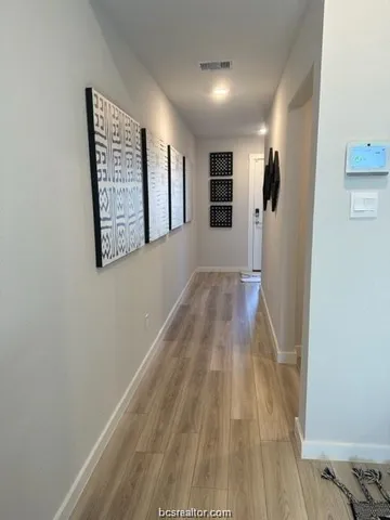 a view of entryway with wooden floor