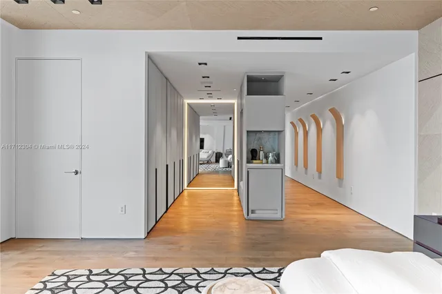 a view of living room filled with furniture and wooden floor