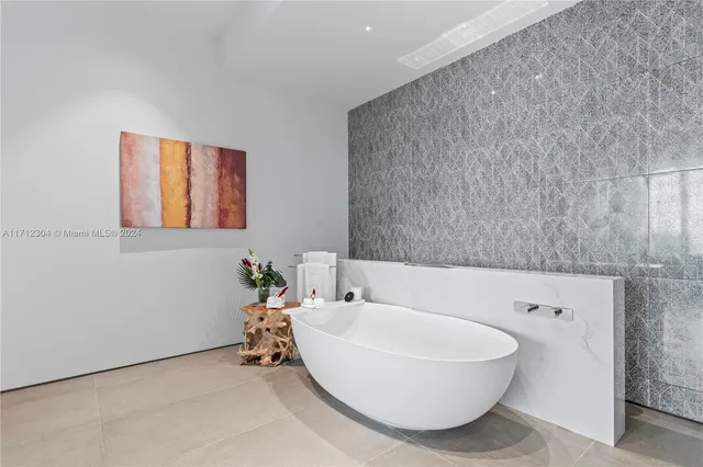 a bathroom with a bathtub and a sink