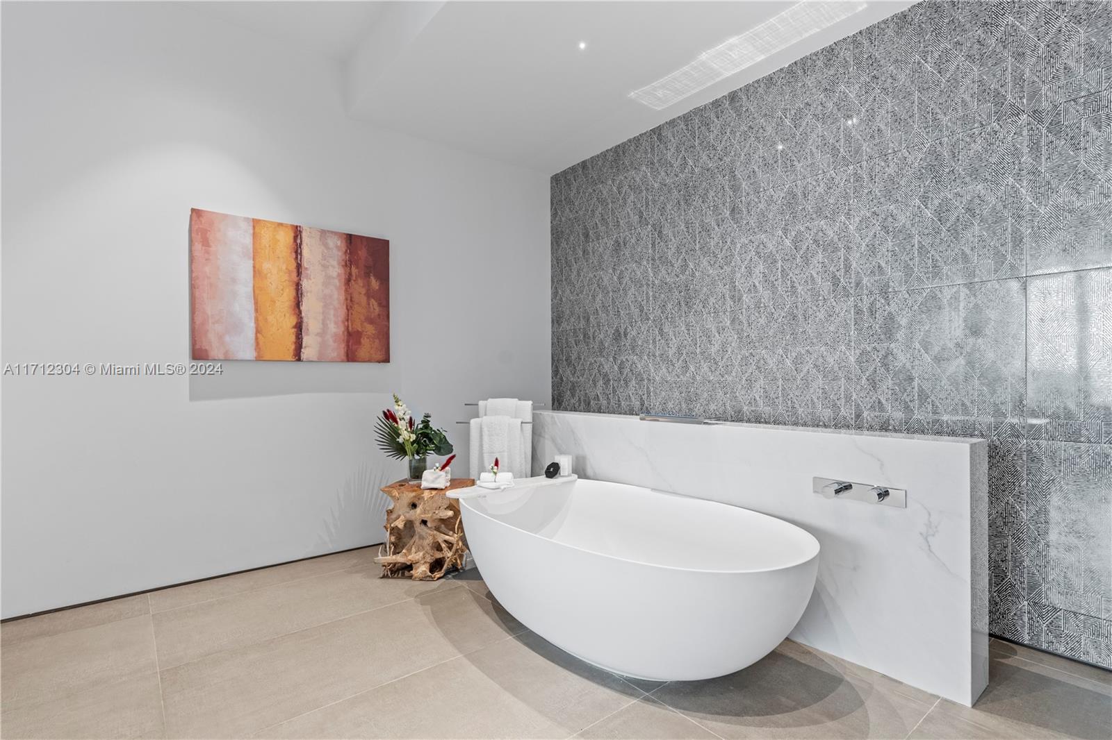 650 Northeast 32nd Street, Unit BH2 Miami, FL 33137 - Photo 13 of 30 a bathroom with a bathtub and a sink