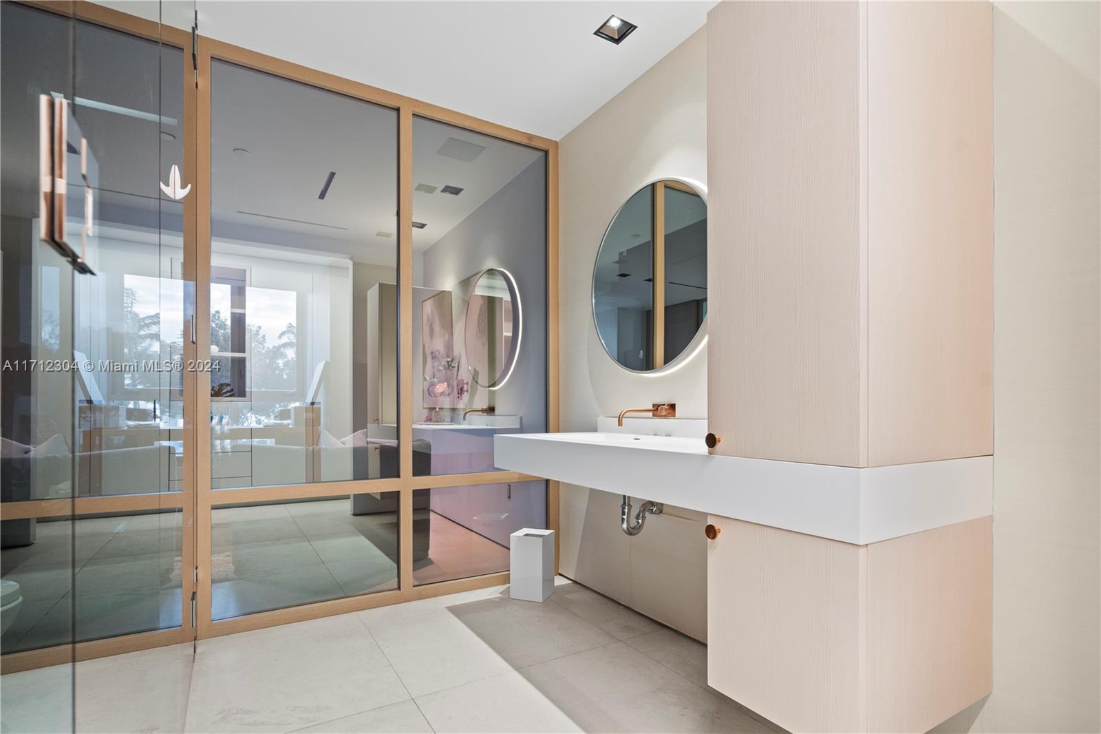 650 Northeast 32nd Street, Unit BH2 Miami, FL 33137 - Photo 19 of 30 a bathroom with a double vanity sink mirror and bathtub