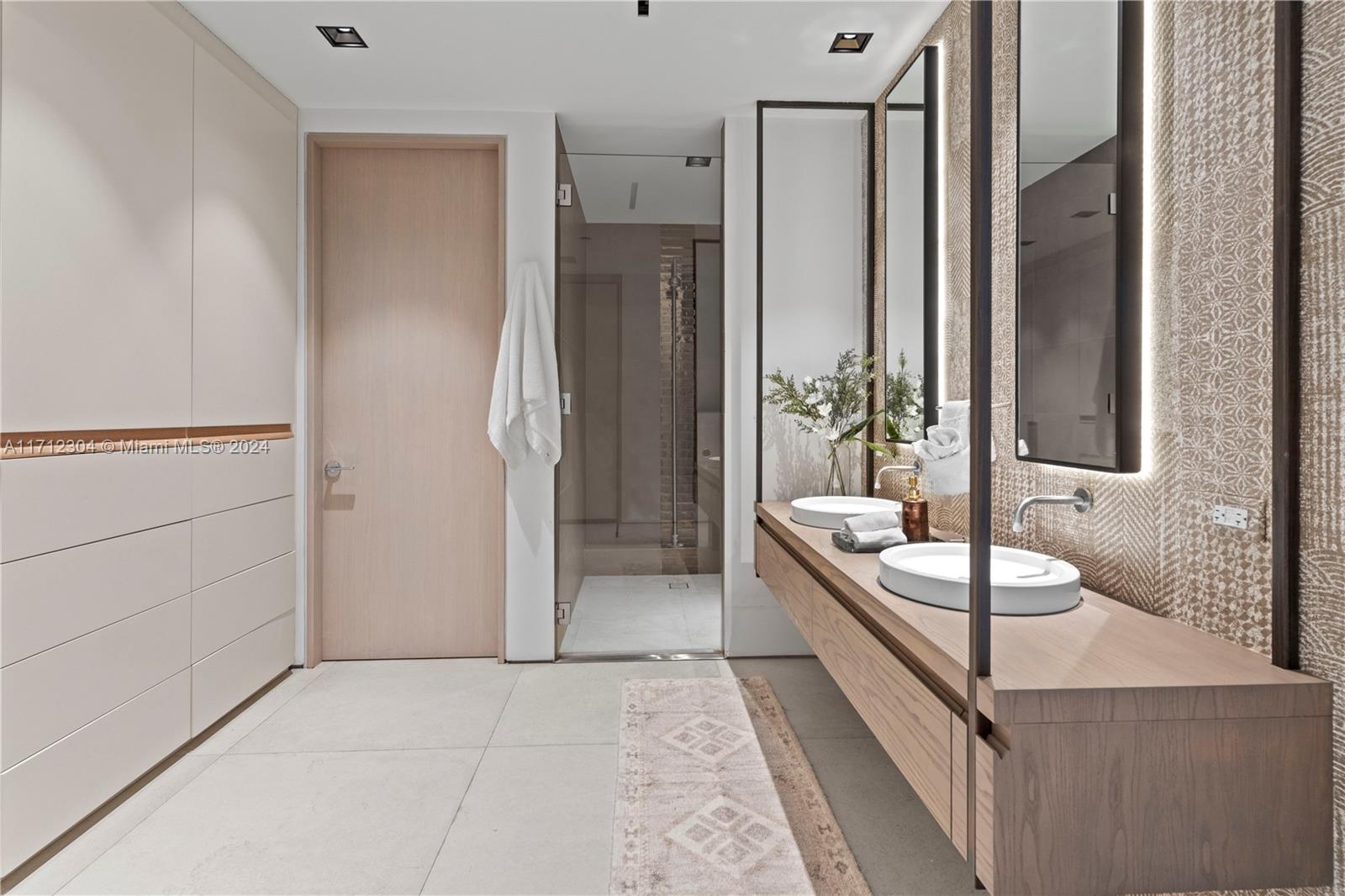 650 Northeast 32nd Street, Unit BH2 Miami, FL 33137 - Photo 22 of 30 a bathroom with a tub shower and sink