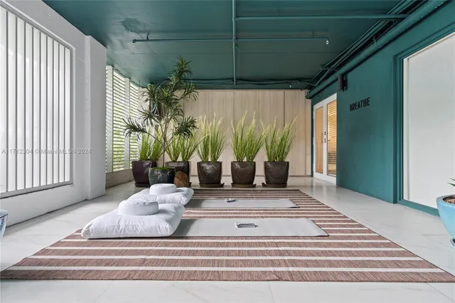 a view of spacious bedroom with a balcony