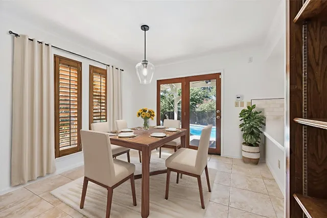 a view of a hallway with wooden floor and stairs